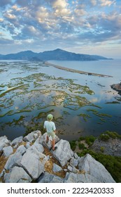 Aerial view of Dalyan river, Iztuzu beach, sea, mountains and lakes. Happy hiker man above the wild nature  - Shutterstock ID 2223420333