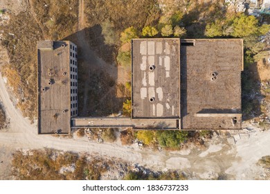 Aerial view of damaged and abandoned house in rural area. Abandoned and destroyed house.