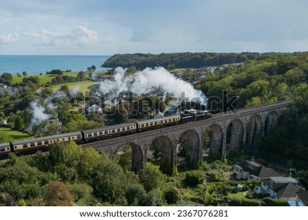 Aerial view of Dartmouth Steam Train on Hookhills Viaduct by the sea in Paignton, Devon