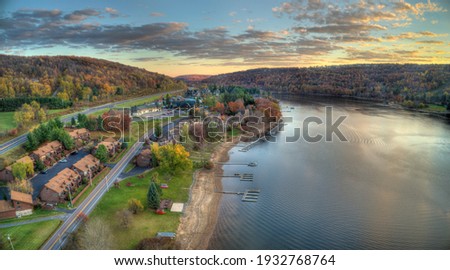 An aerial view of Deep Creek Lake during sunset in the fall season