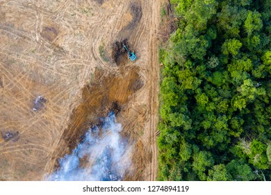 Aerial view of deforestation.  Rainforest being removed to make way for palm oil and rubber plantations