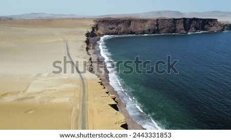 Aerial view of desert landscape in Peru Meeting the Pacific Ocean