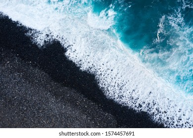 Aerial view of a deserted black volcanic beach. Coast of the island of Tenerife, Canary Islands, Spain. - Shutterstock ID 1574457691