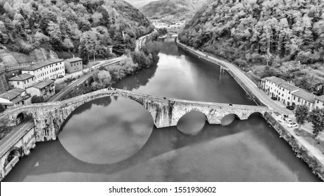 Aerial  view of Devils Bridge - Ponte della Maddalena is a bridge crossing the Serchio river near the town of Lucca, Tuscany