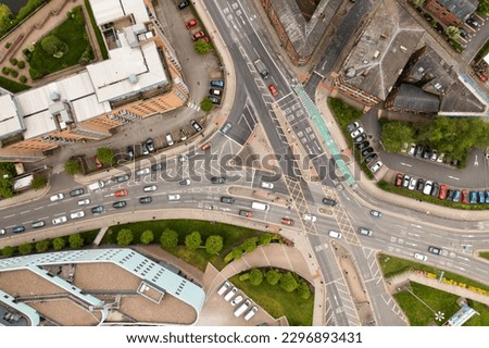 Aerial view directly above a complex road junction or intersection with traffic travelling in different directions