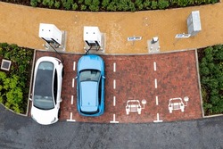 An Aerial View Directly Above Electric Cars Being Charged At A Motorway Service Station Car Charging Station