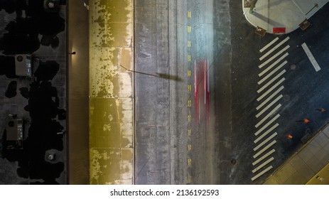 An Aerial View Directly Above An Intersection At Night In Long Island City, NY. The Area Is Illuminated With No People In View.