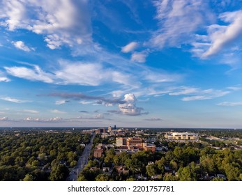 Aerial View Of Distant Lexington, Kentucky Downtown District With A Lot Of Trees And Parks Surrounding It.