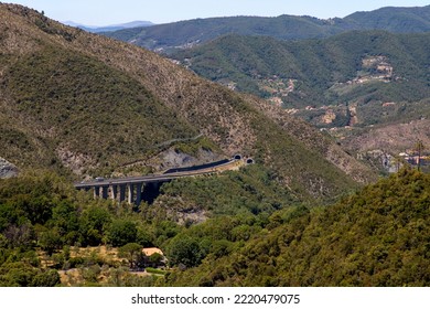 Aerial View Of Divided Highway Entering A Mountain Tunnel