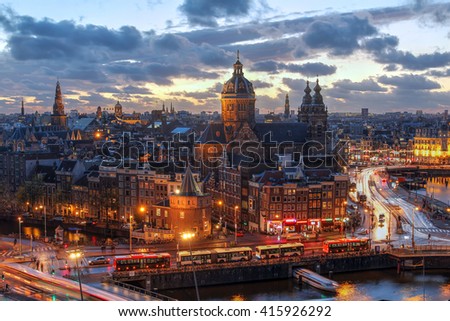 Aerial view of downtown Amsterdam, The Netherlands during a dramatic beautiful sunset. 