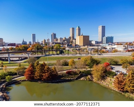 Aerial view of the downtown cityscape and fall color of Veterans Park at Tulsa, Oklahoma