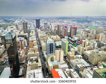 Aerial View Of Downtown Johannesburg And Large South African Flags On Sides Of Building - Johannesburg, South Africa 