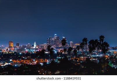 Aerial View Of The Downtown LA Skyline With Palm Trees In The Foreground