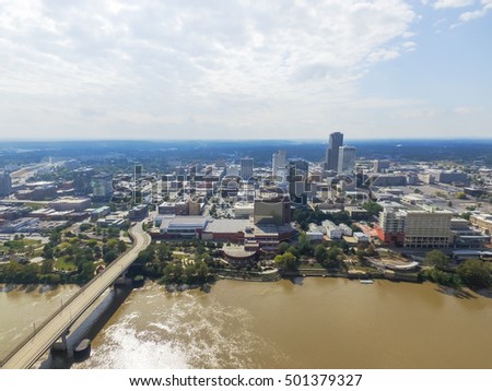 Aerial view downtown Little Rock at the south bank of Arkansas River. Its the capital and most populous city of Arkansas state, US. Main St Bridge and Junction Bridge Pedestrian Walkway across river.
