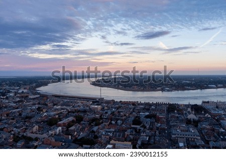 Aerial view of downtown New Orleans, Louisiana and the Mississippi River at sunset in November