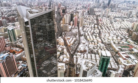 Aerial View Of Downtown Shanghai Near Jing An Temple And Nanjin Road After An Unusual Snowfall In The Morning