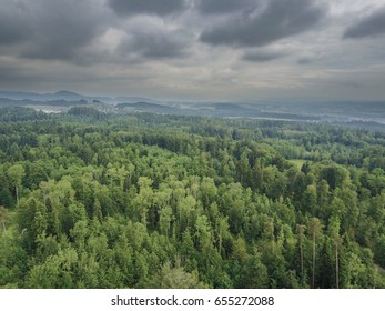 Aerial view dramatic clouds and forest