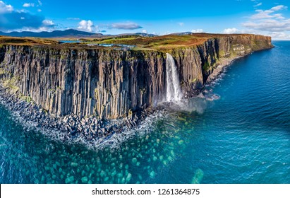 Aerial view of the dramatic coastline at the cliffs by Staffin with the famous Kilt Rock waterfall - Isle of Skye - Scotland.