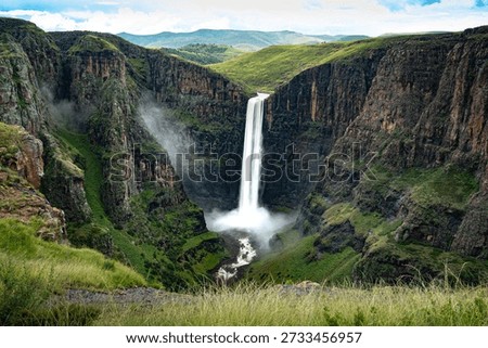 Aerial view of the dramatic Maletsunyane Falls, one of the highest single-drop waterfalls in Africa, plunging into a deep gorge in the rugged highlands of Lesotho. Surrounded by vast green plateaus and cliffs, this iconic natural landmark showcases the raw beauty, scale, and wilderness of the Mountain Kingdom.
