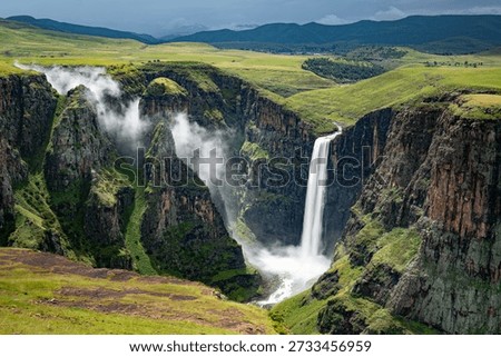 Aerial view of the dramatic Maletsunyane Falls, one of the highest single-drop waterfalls in Africa, plunging into a deep gorge in the rugged highlands of Lesotho. Surrounded by vast green plateaus and cliffs, this iconic natural landmark showcases the raw beauty, scale, and wilderness of the Mountain Kingdom.
