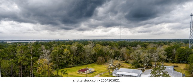 Aerial View of Dramatic Storm Clouds above a rural forest in Southeast Texas during early winter.