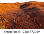 Aerial view of dried river beds running through a barren red outback landscape near Broken Hill In New South Wales, Australia