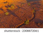 Aerial view of dried river beds running through a barren red outback landscape near Broken Hill In New South Wales, Australia