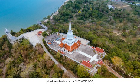 Aerial View With Drone, Buddhist temple with white pagoda in Thailand , Wat Khao Suwan Pradit Donsak Drone flying view landscape , Travel Landmark