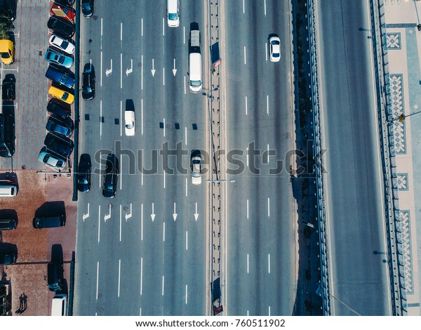 Aerial\
view from a drone of cars running on the\
highway