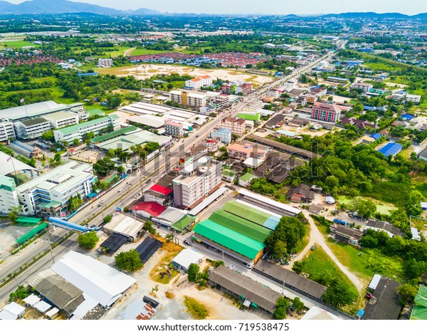 Aerial view from drone of houses,
school, apartment, street and so on in the suburb,
Thailand