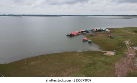 Aerial View From Drone Of Kalasin Park ,a Large Lake Surrounded By Small Parks In Kalasin, Thailand.The Locals Come To Run, Walk, Cycle And Chill Out With The Sunflower Field. 