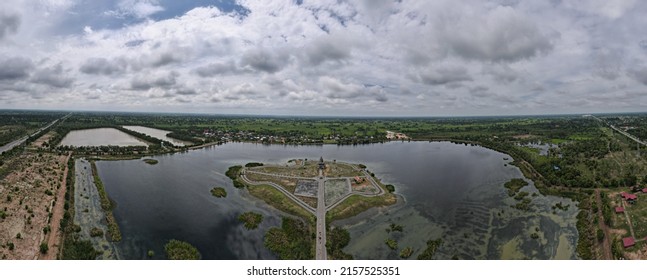 Aerial View From Drone Of Nong-Tung Park ,a Large Lake Surrounded By Small Parks In Kalasin, Thailand.The Locals Come To Run, Walk, Cycle And Chill Out With The Sunflower Field. 