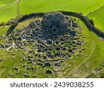 Aerial view with drone of the Nuragic archaeological complex of Su Nuraxi di Barumini. The Bronze Age fort, a UNESCO World Heritage Site. Barumini, Sardinia, Italy