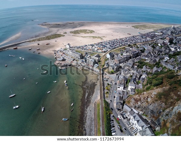 Aerial view, Drone panorama over sea,\
harbor, beach and old town of Barmouth,\
Wales