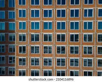 Aerial view from a drone to a pattern from the windows of an unfinished building