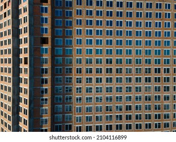 Aerial view from a drone to a pattern from the windows of an unfinished building