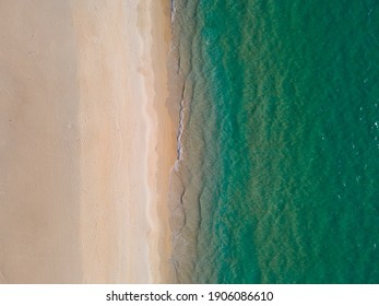 Aerial view of drone. Top view beach sand and sea water texture on sandy beach.