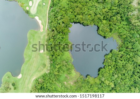 Aerial view drone Top down shot of beautiful green golf field High angle view in summer time.