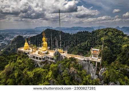 Aerial view from drone of Wat Tham Suea The Tiger Cave temple well known temple on a hilltop in Krabi, Thailand.