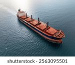 Aerial view of dry cargo ship. Bulk carrier cargo vessel. Ship logistic and transportation business industry.