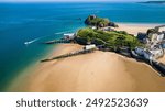 Aerial view of the dry harbor and large sandy beach at low tide in Tenby, Pembrokeshire