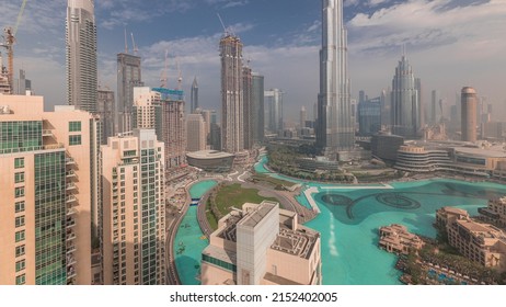 Aerial View Of Dubai City Early Morning Timelapse In Downtown. Futuristic City Skyline With Skyscrapers And Towers From Above. Construction Site With Cranes