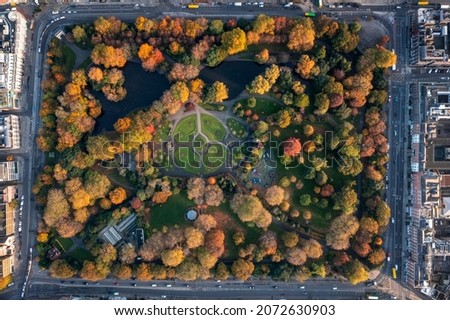 Aerial view of Dublin city center at sunset with Saint Stephen's Green park in Dublin, Ireland
