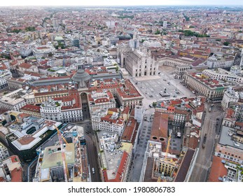 Aerial view of Duomo di Milano Cathedral in Duomo Square. Gothic cathedral in the center of Milan. Drone view of the gallery and Milano rooftops, in north Italy, Lombardia. Birds eye of facade.