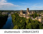 Aerial View of Durham City England, Drone point of view, Historic Durham Cathedral sits on a hill in the sunshine, surrounded by the River Wear. 