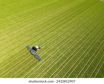 Aerial view of a dutch farmer working on its land, Flevoland, The Netherlands - Powered by Shutterstock