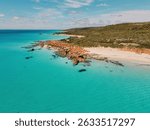 Aerial view of Eagle Bay in Meelup National Park, WA. Clear turquoise water and white sand beach surrounded by native bush. Perfect for travel, nature, and coastal themes.