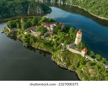 Aerial view of early Gothic Zvikov castle on difficult-to-access and steep promontory above the confluence of the Vltava and Otava rivers in Bohemia
