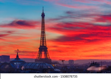 Aerial view of Eiffel tower and the rooftops of Paris during a gorgeous sunset, France