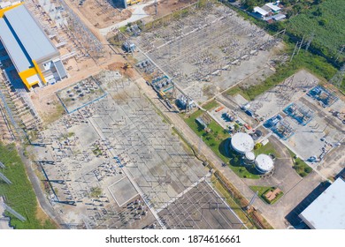 Aerial View Of Electricity Generating, Voltage Poles. Power Lines On Utility Tower And Cable Wires In Energy Electric Technology, Network, And Industry. Generator Pylon. Transmission And Substation.